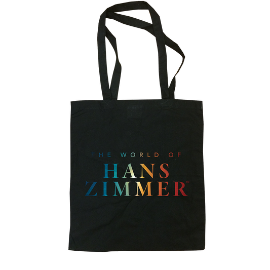 Black tote bag with 'The World of Hans Zimmer' text in colorful letters on a white background