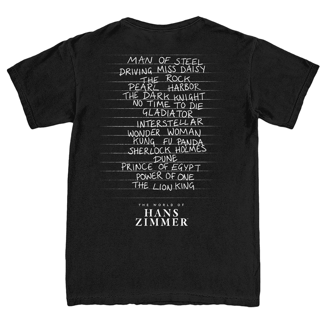 Black t-shirt with white text listing famous movies and 'The World of Hans Zimmer' on a white background