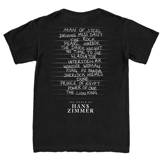 Black t-shirt with white text listing famous movies and 'The World of Hans Zimmer' on a white background